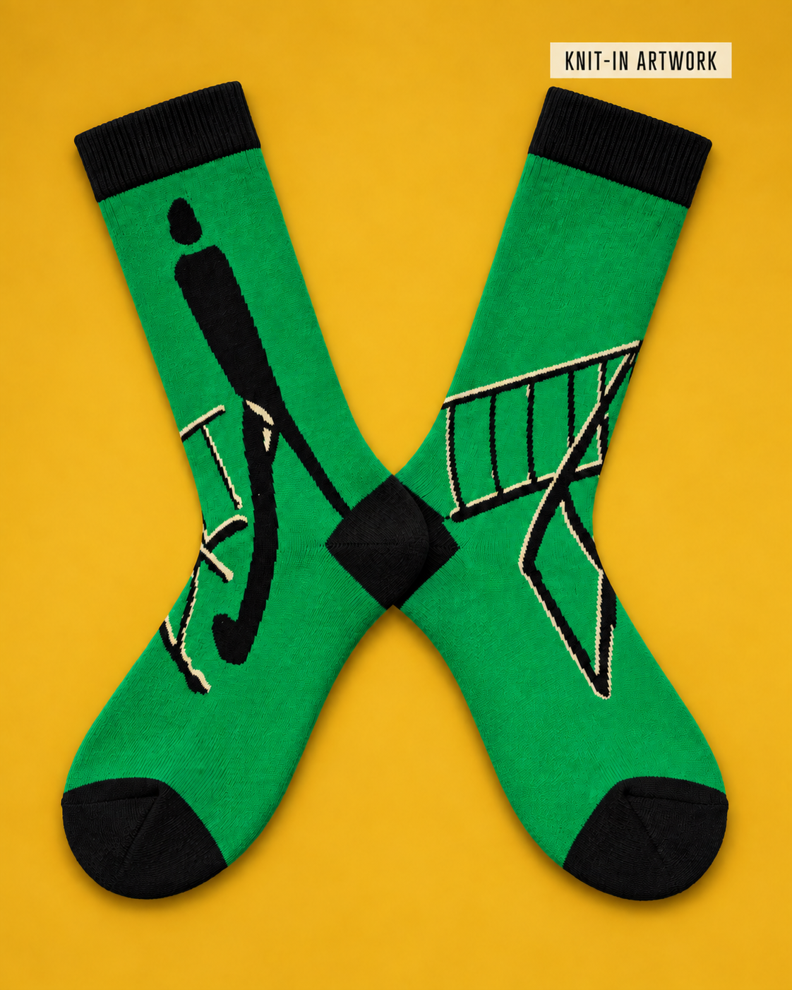 Green K. IN MOTION socks laid flat to show the knitted artwork